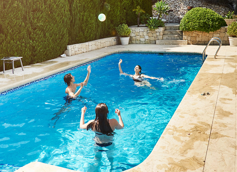 woman throwing ball with son
